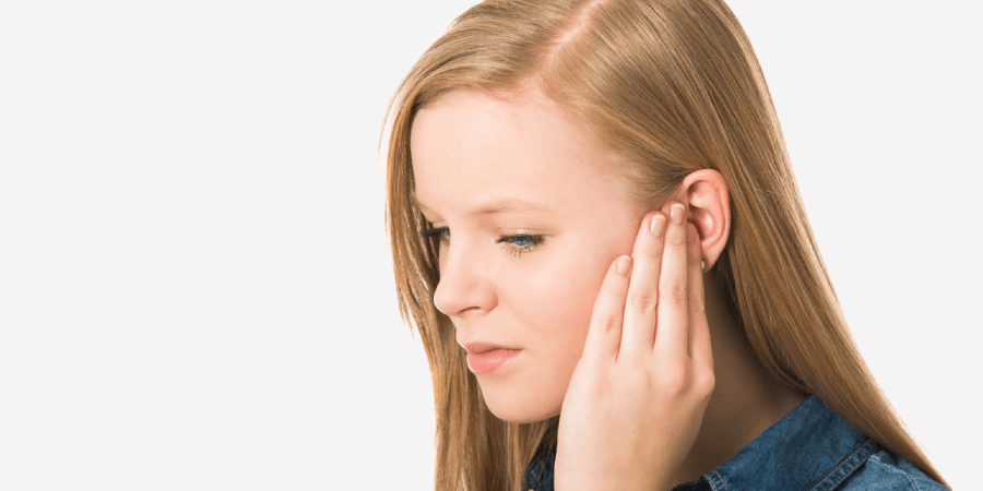 Woman Suffering From Tinnitus