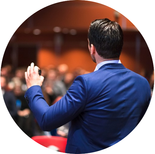 Businessman Speaking At Conference
