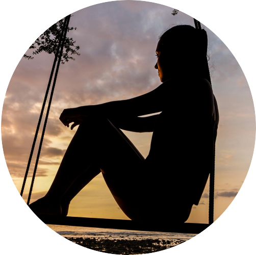 Girl Thinking On Swing