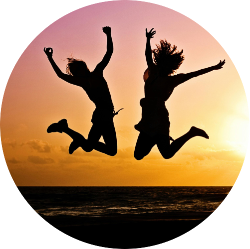 Girls Jumping In The Air In Sunset
