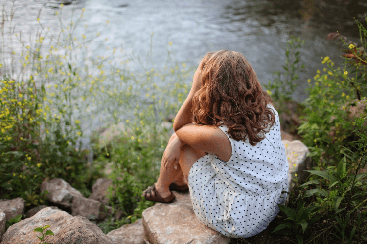 Stressed Woman By A Lake
