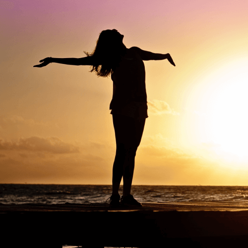 Happy Woman Posing With Arms Wide Apart