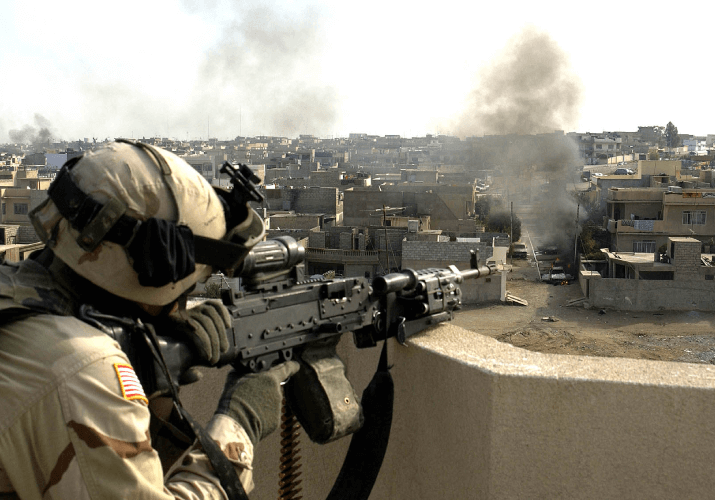 Soldier Firing A Gun In Combat