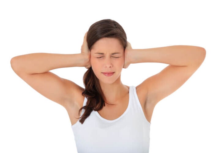Woman Suffering From Tinnitus
